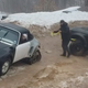 Illustration for article titled Just a Porsche 911 on Treads, Pulling a Toyota Tacoma From the Mud